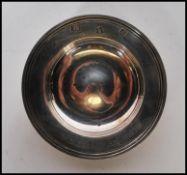 A silver hallmarked pin dish, engraved to the cent