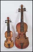 TWO VINTAGE TIN MUSICAL INSTRUMENTS VIOLINS