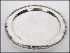 A silver hallmarked cabinet plate having decorativ