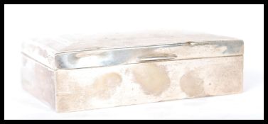 A silver hallmarked table top cigarette case with