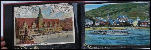 A album of early 20th Century and later postcards,