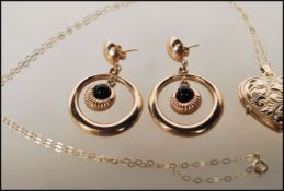 A 9ct stamped link chain necklace with a gold meta