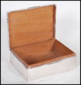An early 20th Century silver hallmarked cigarette box having engraved emblem for the Royal Army