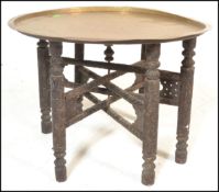 A late 19th / early 20th Century Eastern / Persian/ North African Benares brass topped circular