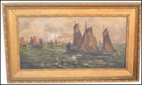 A early 20th Century oil on canvas of a seascape having Dutch sailing boats with figures in a rowing