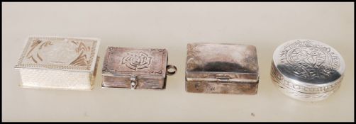 A group of silver boxes to include a stamped BSY Indian silver pill box with an embossed deity to