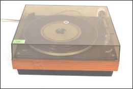 A vintage Bang and Olufsen Beogram 1000 teak and ebony record deck turntable having original perspex