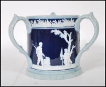 Golfing Interest- A early 20th Century Copeland Late Spode loving cup having a dark blue cobalt