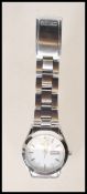 A Seiko gentleman's stainless steel wrist watch having a round white face with silvered baton