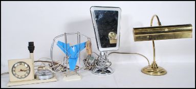 A collection of vintage and retro items to include a brass bankers desk lamp, a retro desk fan,
