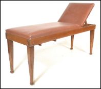 An early 20th Century Edwardian examination / massage table, upholstered with a brown tan rexine