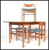 A retro 20th Century teak wood Danish inspired dining suite, consisting of extendable dining table