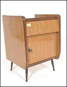 A vintage mid 20th century retro vintage wood grained formica bedside cabinet having a single