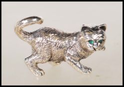A sterling silver figure in the form of a playing cat. Stamped sterling. Gross weight 16.9g.
