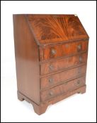 AQ 20th Century Georgian revival flame mahogany bureau fall front with appointed interior over