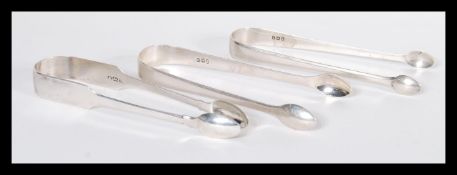 A group of three early 19th Century Georgian hallmarked silver sugar tongs or nips comprising of
