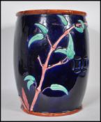A late 19th Century Majolica opium stool / plant stand in the manner of Minton on a rich cobalt blue