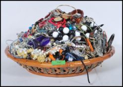 A collection of vintage and contemporary costume jewellery to include bracelets, bangles, necklaces,