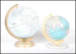 Two retro 20th Century globes one by Replogle World Scholar Series textured in relief. Together with