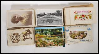 A group of 20th Century postcards and cigarette cards to include various black and white examples,