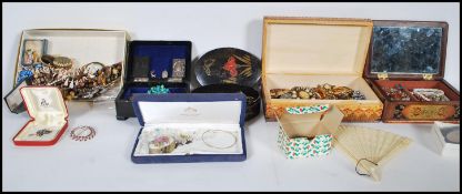 A large collection of vintage costume jewellery to include an interesting selection of mid Century