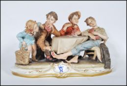 A large Capodimonte figure group signed by Merli, 'The Card Cheat', featuring four card players