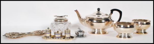 A collection of vintage 20th Century silver plated items to include tea service,cruet set, rococo