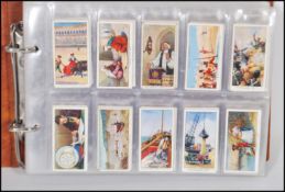 A collection of trade cards and giveaway cigarette cards, to include full and part sets - The