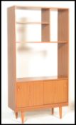 A retro 20th Century teak wood room divider bookca