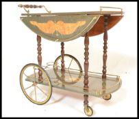 A retro 20th Century Italian style marquetry inlaid two tier drinks trolley with gilt metal mounts