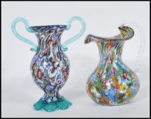 Two 20th Century Murano glass vases both having coloured millefiori designs to include a waisted