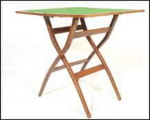 A 1930's Art Deco folding walnut metamorphic gaming table having a square green felted table top