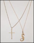 Two 9ct gold fine necklace chains and pendants to include a 9ct gold hallmarked crocodile pendant