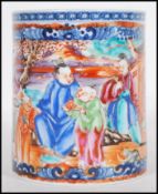 A 19th Century Chinese mug having a hand painted panel of a narrative scene depicting family in a