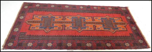 A hand knotted woolen Herati Baluchi carpet floor rug, central panel with traditional motif and