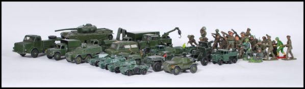 A group Dinky diecast army trucks to include two Scout Cars, two Austin Champ, Cargo Truck, 3 Ton