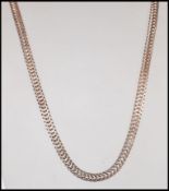 A stamped 925 silver flat link snake chain having a lobster clasp. Weight 42.5g. Measures 55cm.