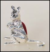 A stamped 925 sterling silver pin cushion in the form of a kangaroo having a red velvet pincushion