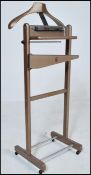 A mid 20th Century gentleman's valet stand having original markings 'The Versatile Valet Made in