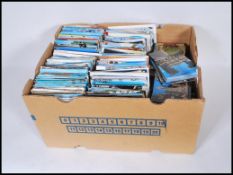 A large postcard accumulation contained within a Banana box.Vast quantity approx 4,000 worldwide