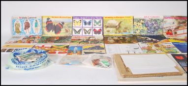 A collection of vintage 20th Century World stamps to include decimal and pre decimal contained in