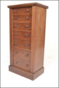A 19th century Victorian Wellington pedestal chest of drawers being raised on plinth base with a