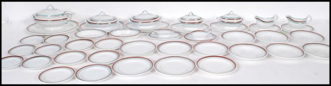 A 19th Century French childs miniature dinner service consisting of plates, platters, and tureens,