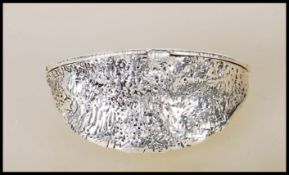 A stamped 925 sterling silver purse in the form of almond nut. Weighs 41.5g. Measures 3cm tall by