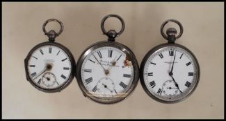 A group of three early 20th Century silver pocket watches to include an 'Acme Lever' H Samuel pocket