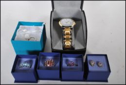 A collection of individually boxed dress jewellery items to include a pair of hallmarked 9ct gold