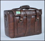 A vintage 20th Century 35mm Cannon A-1 camera, lenses and accessories, all housed in original period