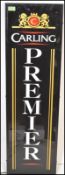 An upright advertising light box for ' Carling Premier ' having a perspex front with mounted back.