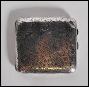 A silver hallmarked cigarette case, chase decorated design with Birmingham assay, makers mark for