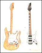Two 20th Century six string electric guitars to include an Ibanez Gio Stratocaster style six